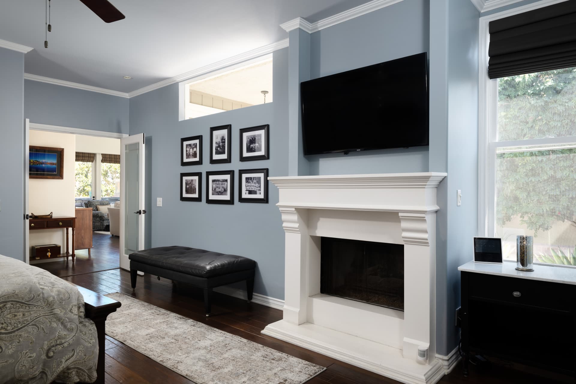 Primary bedroom fireplace with gallery wall