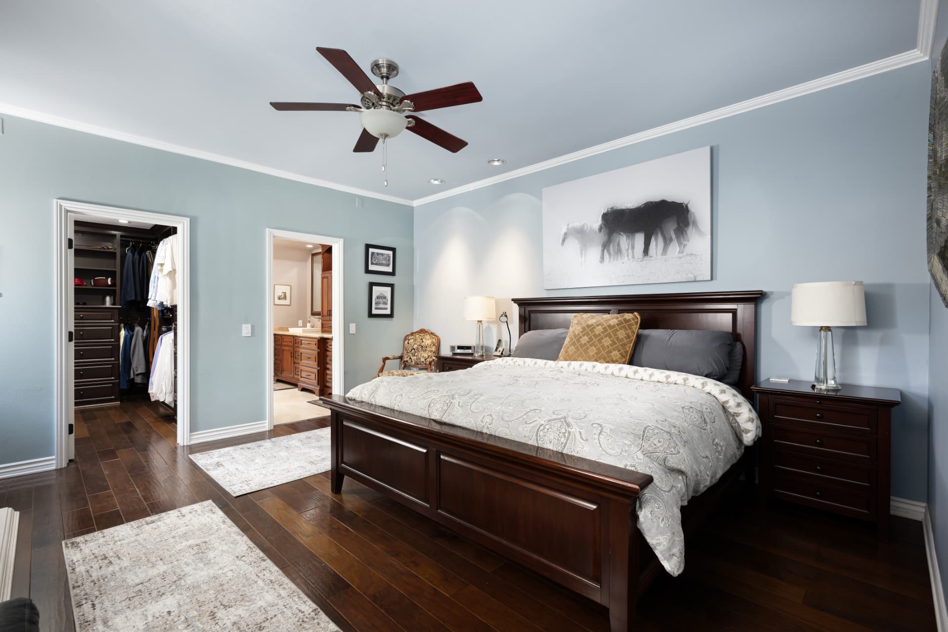Downstairs primary bedroom with king bed and walk-in closet