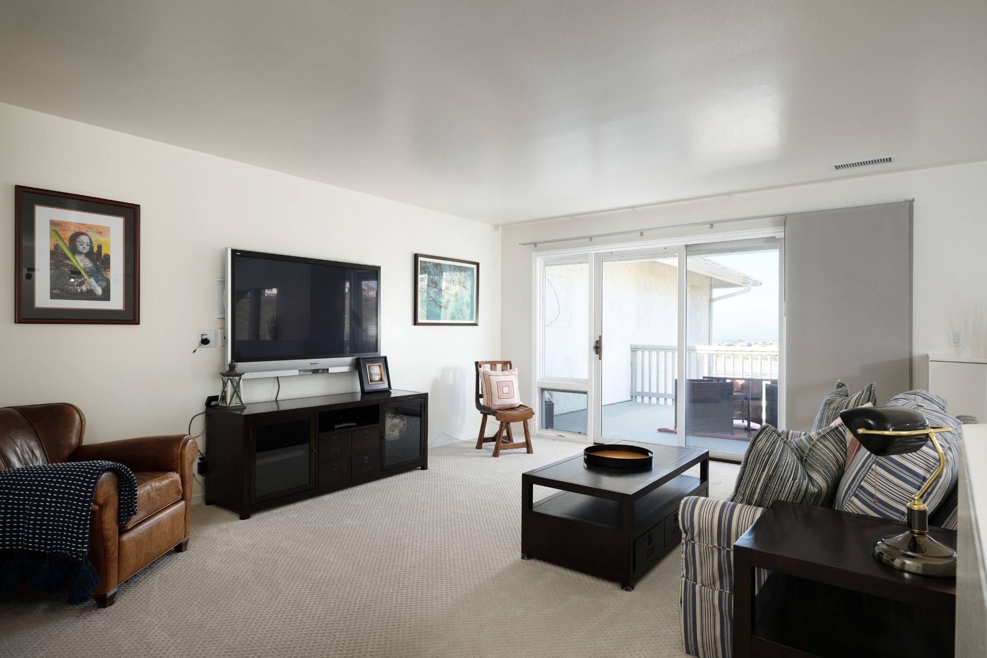 Upstairs family room with balcony access and reservoir views