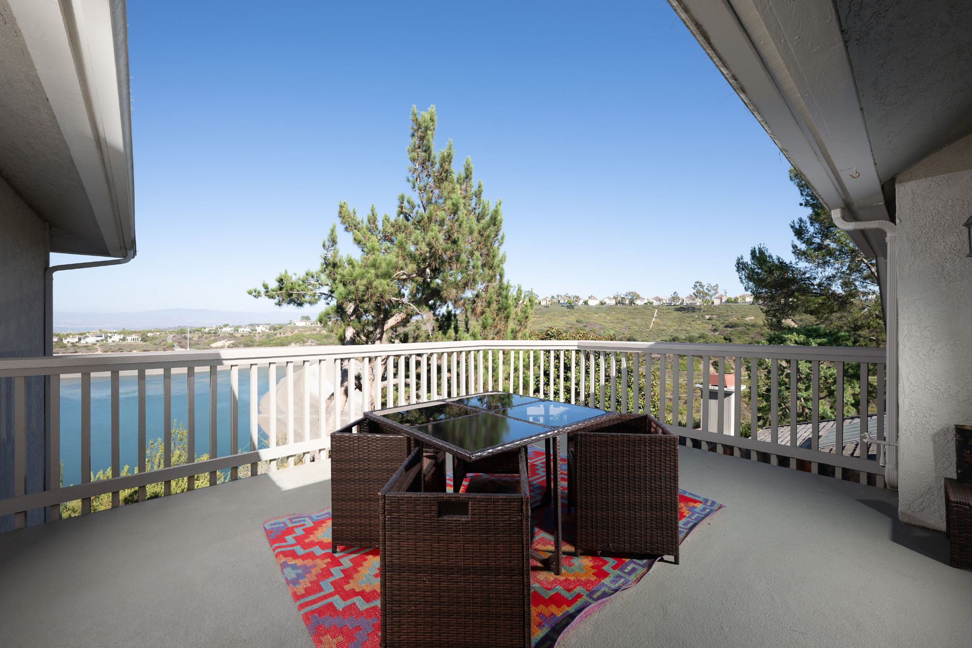 Private view balcony with seating overlooking the reservoir and hillsides